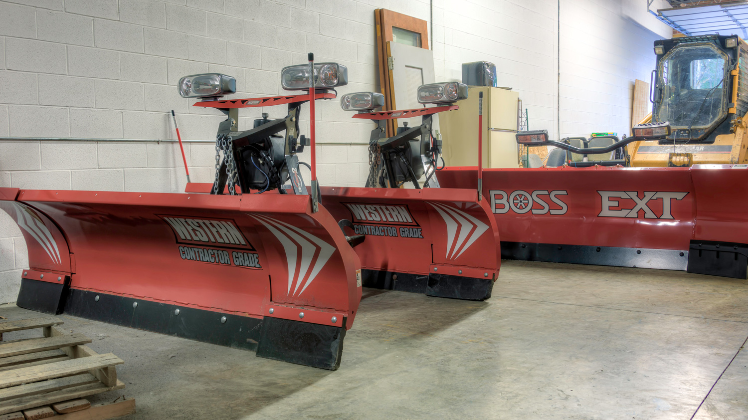 Snow Plows in a row for Sharp Edge Tree and Landscaping